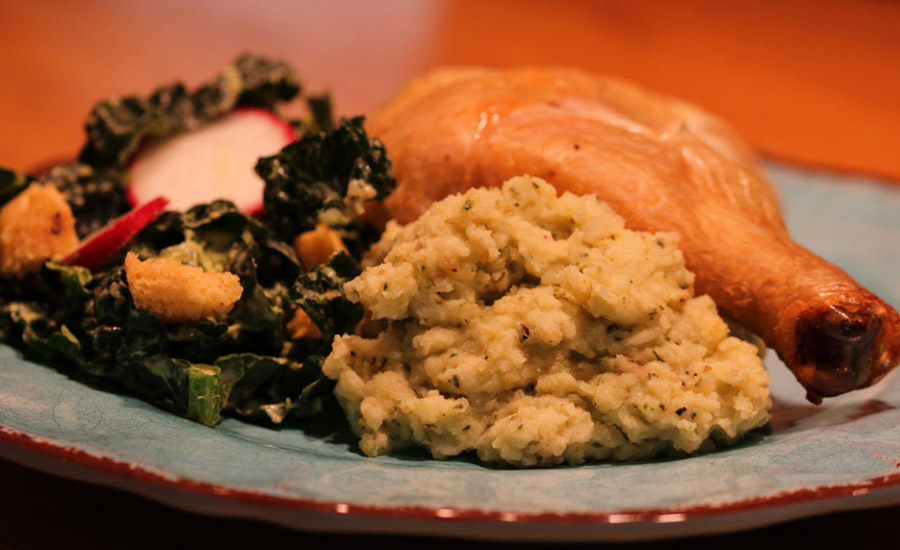 Pistachio Pesto Mashed Potatoes with kale salad and drumstick