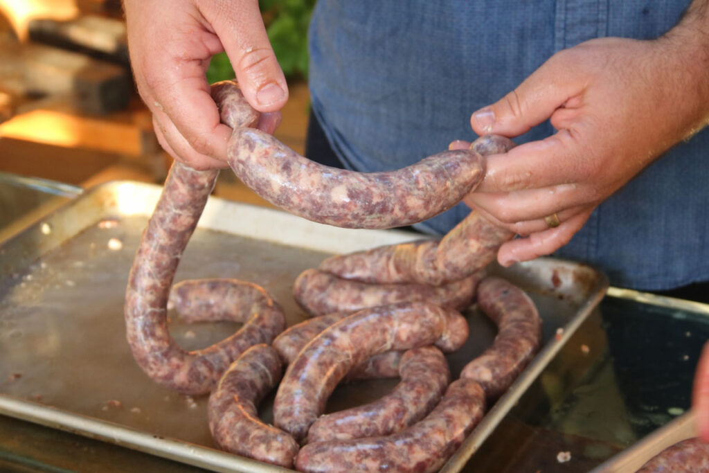 twisting off links from the length of fresh sausage