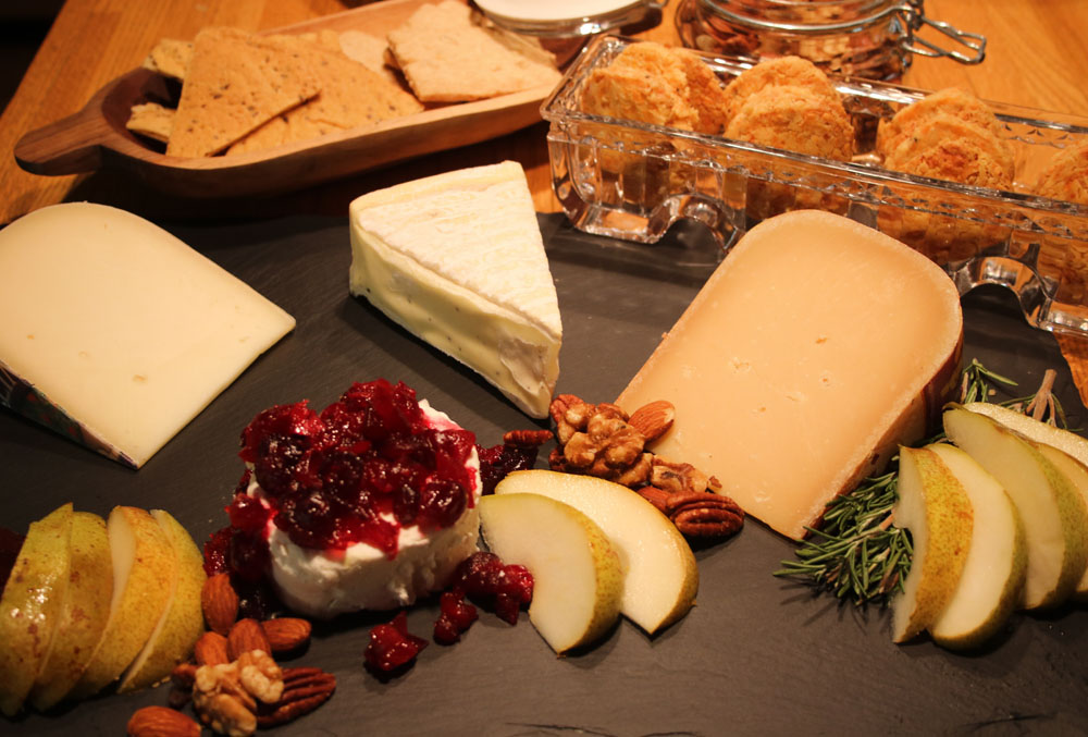 If this is wrong, I don\'t wanna be right, Cheese board with goat cheese with cran chutney, brie, pears and other cheese with crackers and cheese wafers