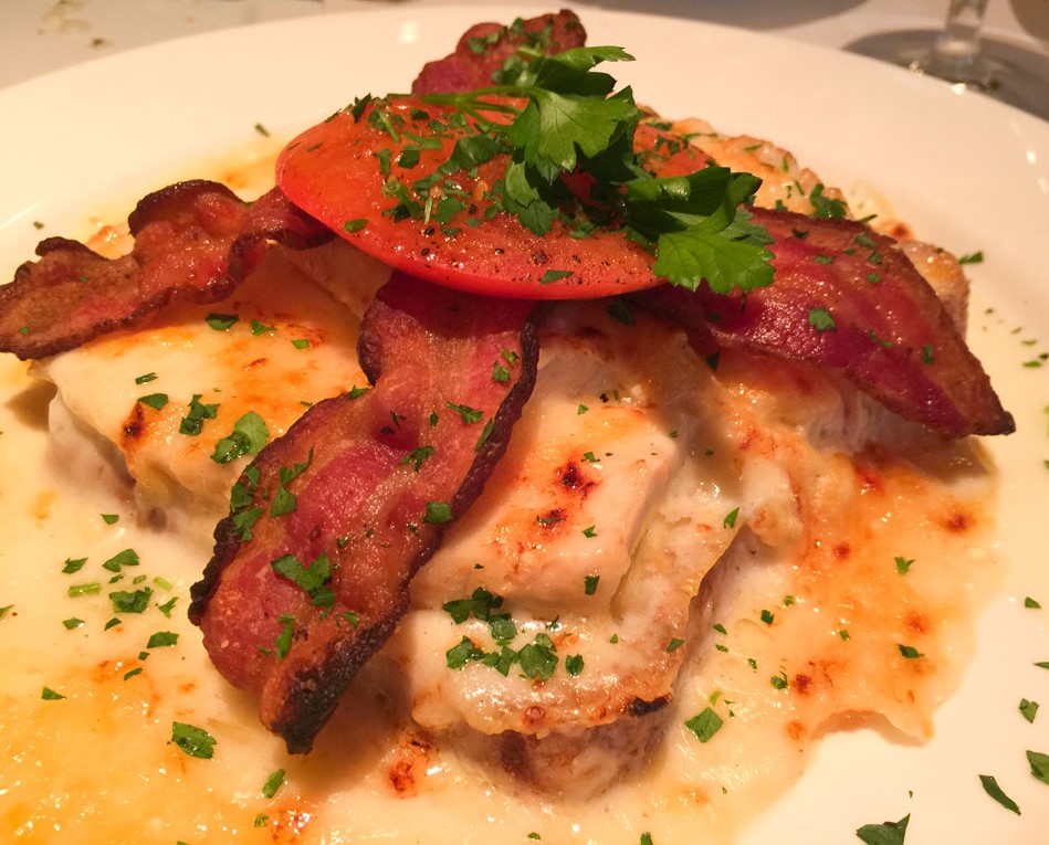 Hot Brown at Bar Americain - topped with bacon, roasted tomato and herbs