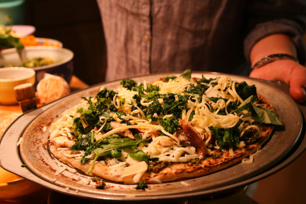 Good Enough to Eat - Pizza with broccolini and grated cheese