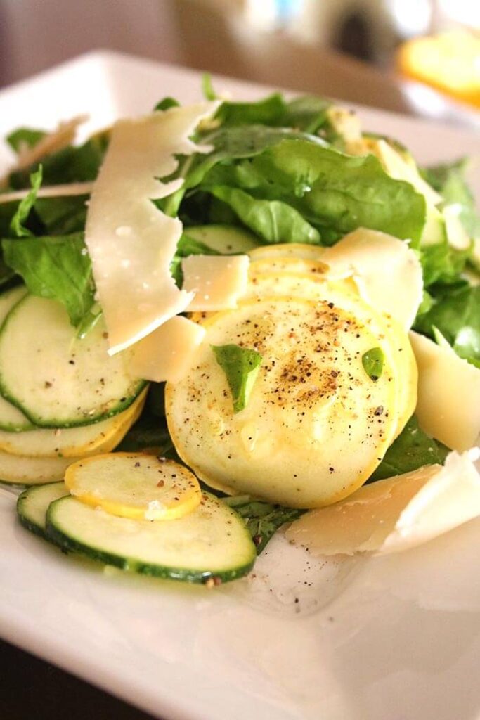 Summer squash with spice blend mixed with arugula and topped with manchego