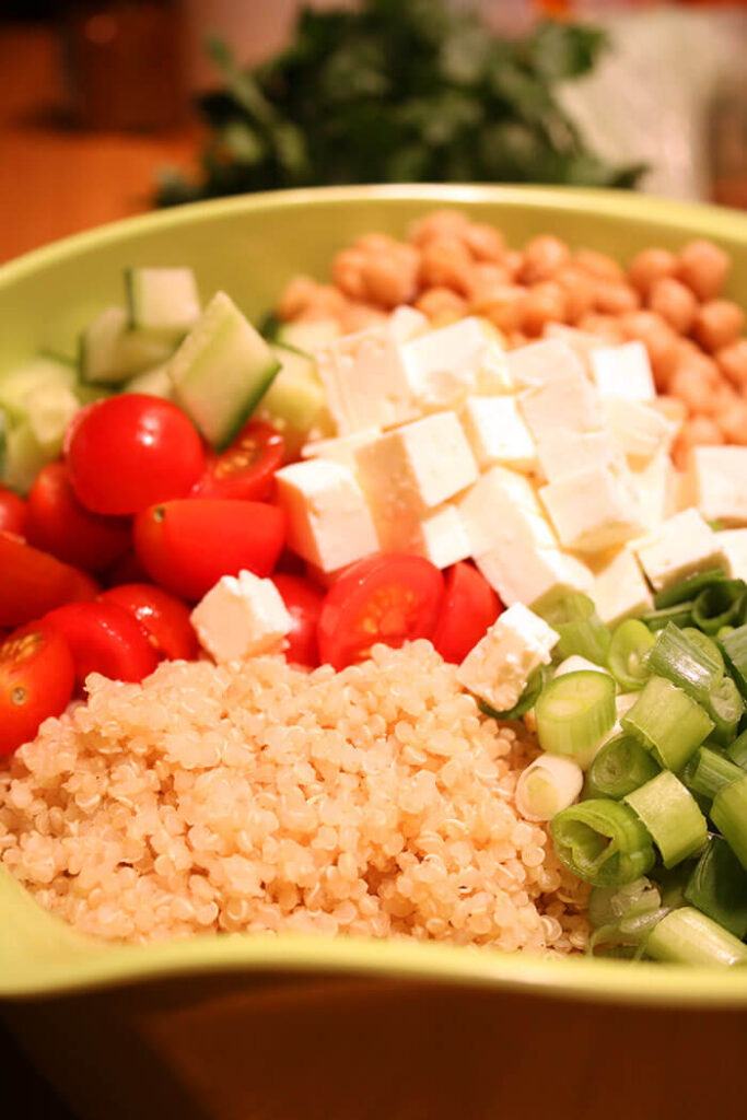 Prepping the Ingredients for the Greek Salad with Quinoa: quinoa, scallions, feta, garbanzo, cucumbers, tomatoes