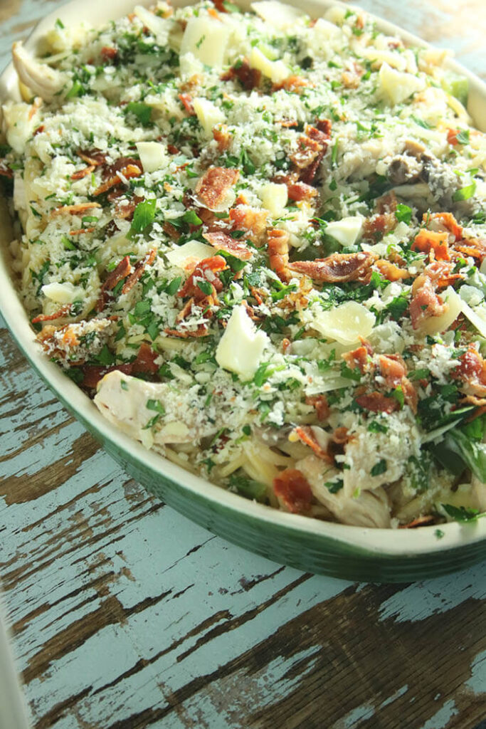 Oven Ready tetrazzini in an oval casserole toped with parmesan and bacon
