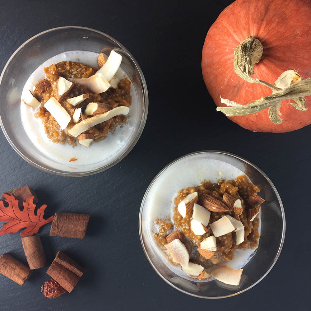 Pumpkin Chia Pudding - Chopped Almonds & Toasted Coconut - overhead shot of two glasses