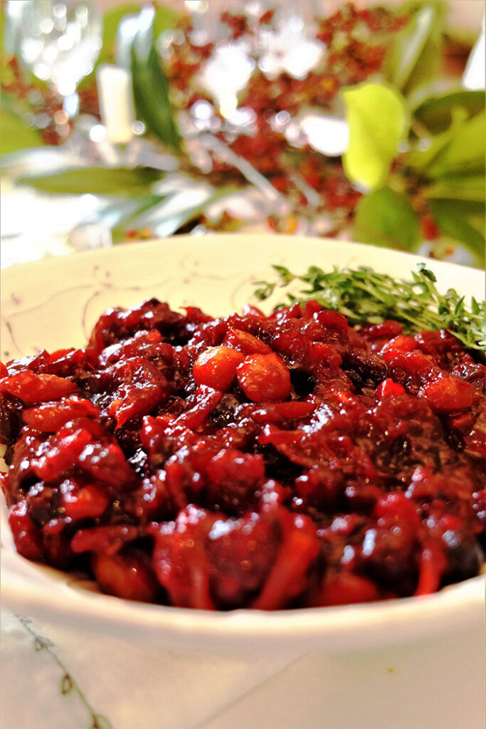 Spicy Chutney with thyme sprig in a cream colored bowl