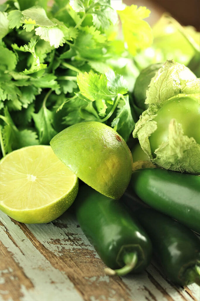 Chilis & Lime with cilantro bunch and tomatillos