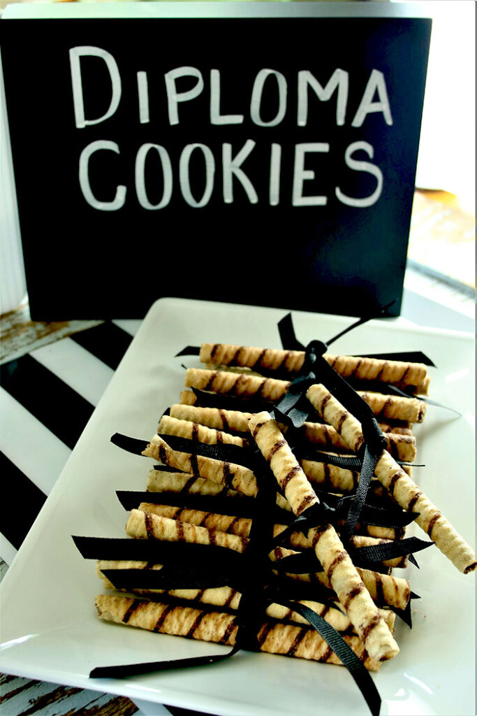 Diploma Cookies tied with a ribbon on a white plate