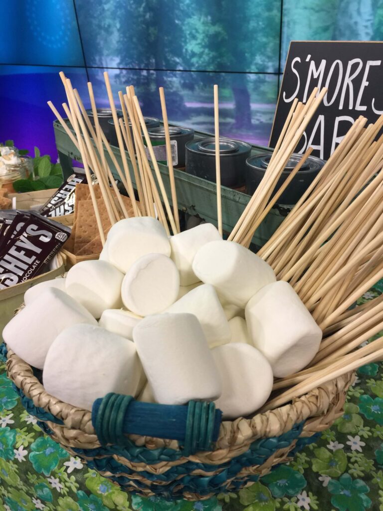 Giant Jet-Puffed Marshmallows in a basket with skewers for a DIY smores bar