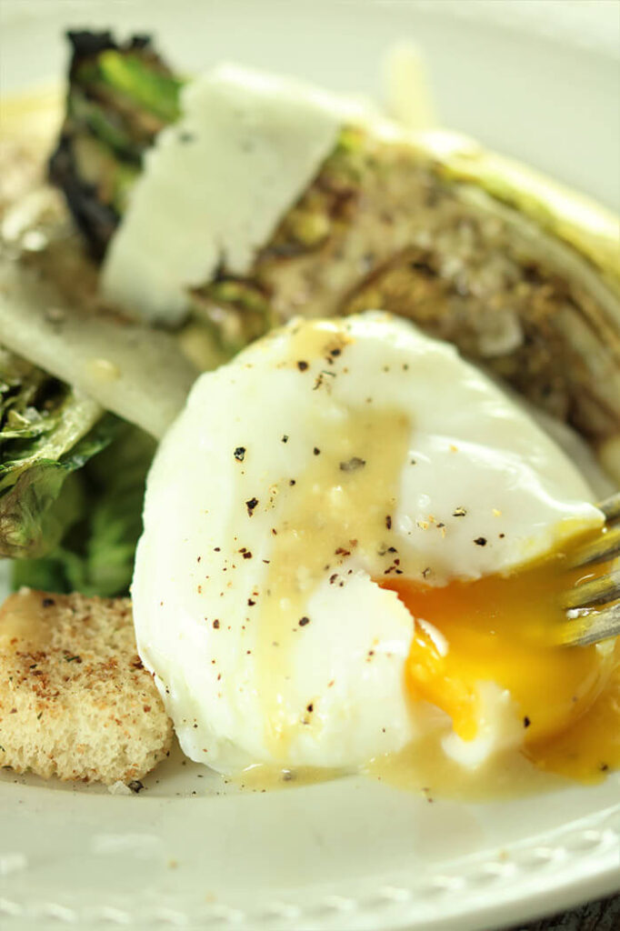 Deconstructed Grilled Caesar with poached egg and croutons