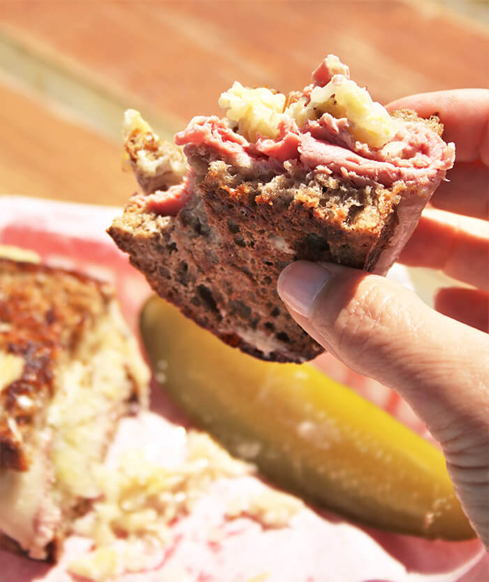 Big Bite of Laughing Tree breads Rueben Sandwich