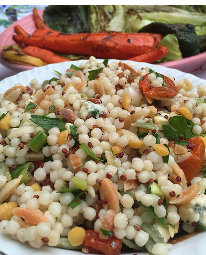 Harvest grain salad with slivered almonds, oven dried tomatoes and herbs