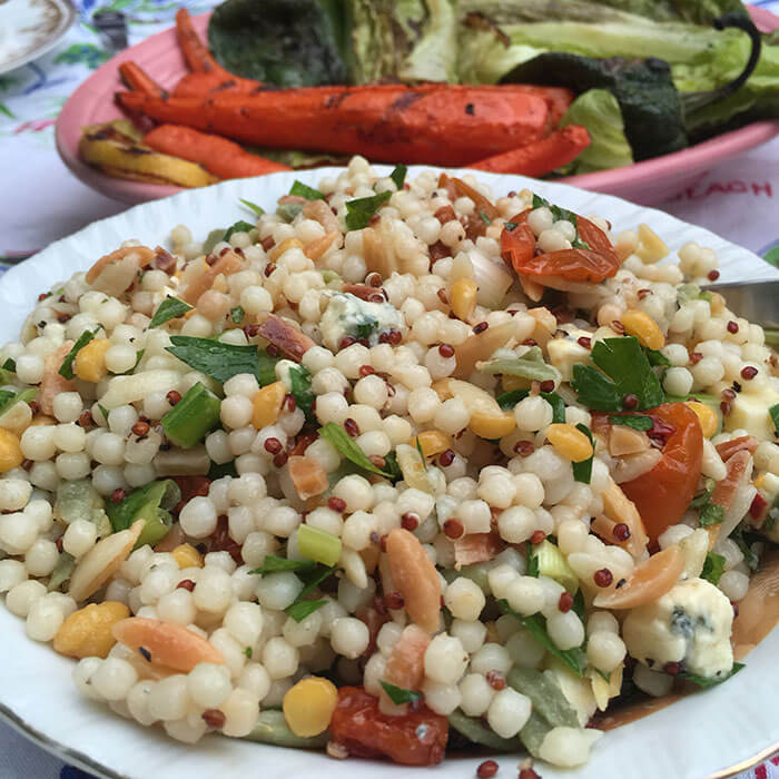 Harvest grain salad with slivered almonds, oven dried tomatoes and herbs