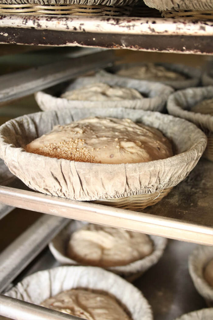 Proofing Baskets on a baker\'s rack at Laughing Tree