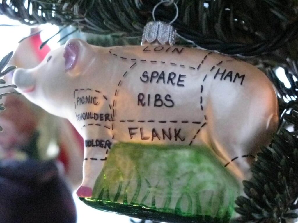 Cuts of meat marked on a pig: flank, spare ribs, ham - tree ornament