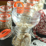 Filling the Spice Jars: rows of flip lid jars being filled with a funnel, tags, twine