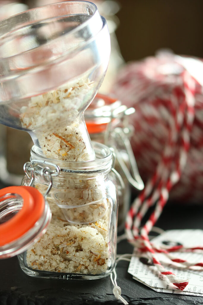 Salt & Pepper Gifts; funnel in the salt jar with a red and white ball of twine