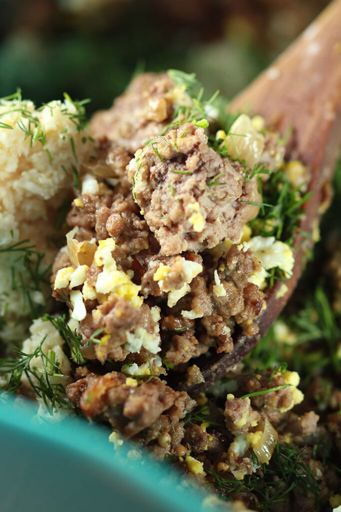 Meat mixture with sieved hard boiled eggs and lots of dill