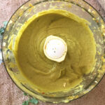 Curried Avo Dressing in a food processor bowl on burlap