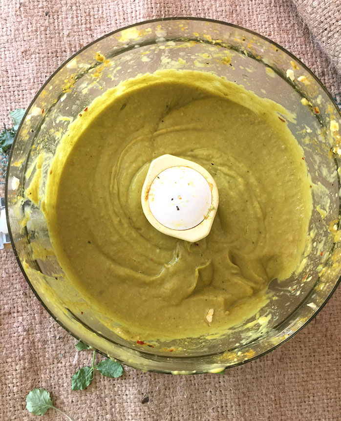 Curried Avo Dressing in a food processor bowl on burlap