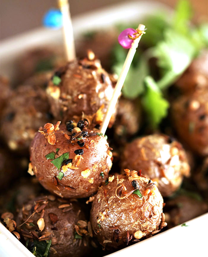 Indian spiced potatoes with colorful toothpicks