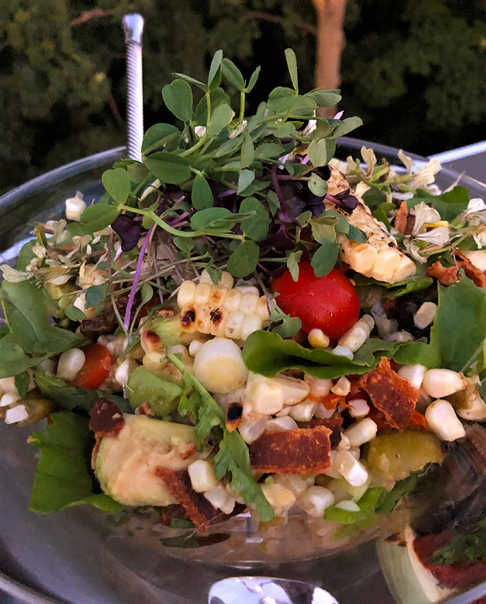 Farmers Market Fresh Corn Salad with microgreens, tomatoes, and bacon