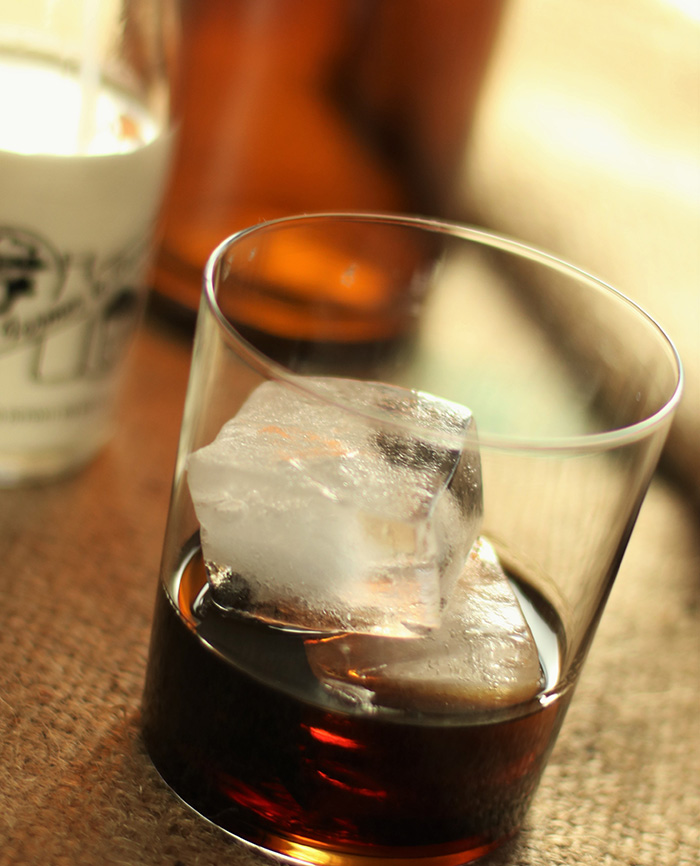 Kahlua cocktail - close up of a glass with large ice cubes and home made kahlua