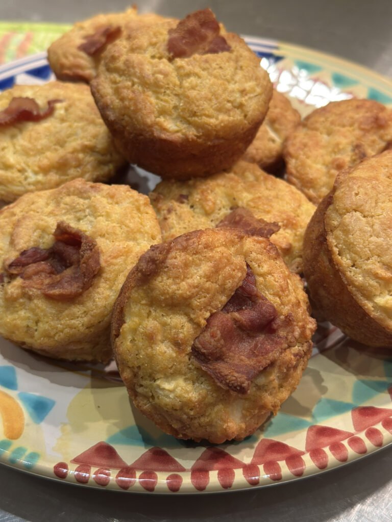 Colorful Southwestern Platter filled with corn muffins with bacon flags.